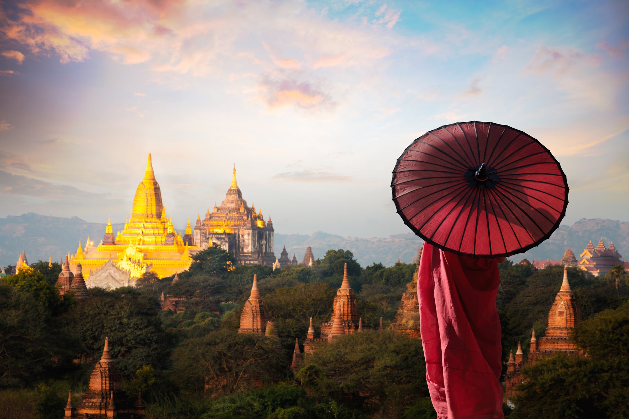 Monk-standing-with-umbrella-Bagan-Mandalay-Myanmar.jpg