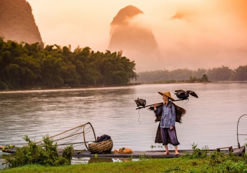 Fisherman of Guilin Li River and Karst mountains Guangxi China