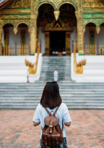 backpack traveling into the national museum in old town district luang Prabang Laos